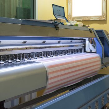 Large format inkjet printer working on sticker sheets with branding